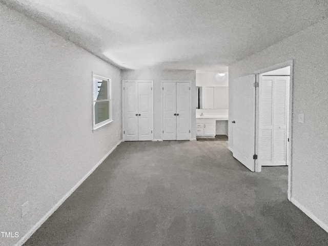 104 Mossbark Ln, Chapel Hill, NC 27514 - empty room with a textured ceiling, a textured wall, and dark carpet