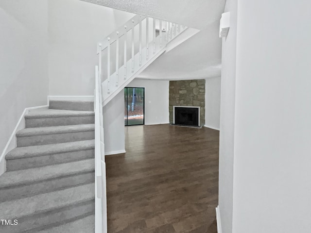 104 Mossbark Ln, Chapel Hill, NC 27514 - stairs featuring wood finished floors and a fireplace