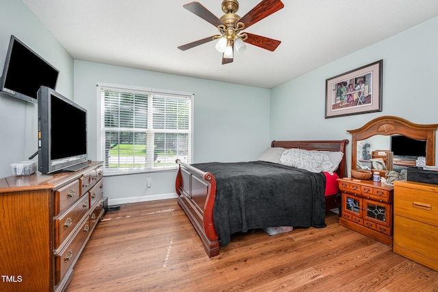 1261 Grovewood Dr, Clayton, NC 27520 - bedroom with wood finished floors and a ceiling fan
