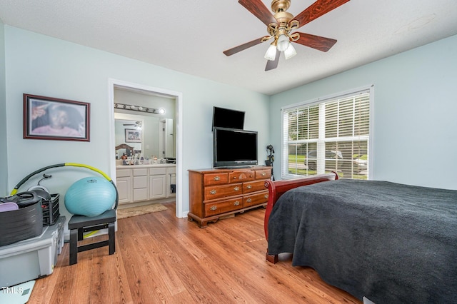 1261 Grovewood Dr, Clayton, NC 27520 - bedroom with light wood-type flooring, connected bathroom, and a ceiling fan