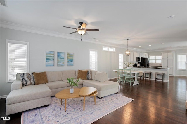 979 Branch Line Ln, Apex, NC 27502 - living area featuring dark wood-style flooring, recessed lighting, a ceiling fan, and ornamental molding