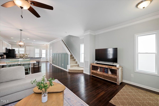 979 Branch Line Ln, Apex, NC 27502 - living room featuring crown molding, stairs, dark wood-style flooring, ceiling fan, and recessed lighting