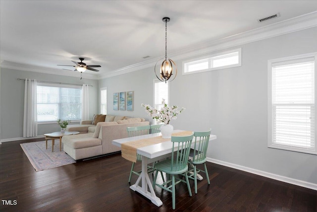 979 Branch Line Ln, Apex, NC 27502 - dining area with ornamental molding, dark wood-style floors, plenty of natural light, ceiling fan, and a chandelier