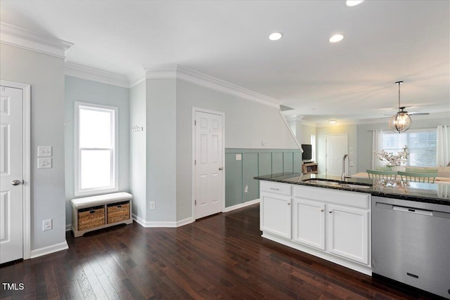 979 Branch Line Ln, Apex, NC 27502 - kitchen featuring dishwasher, dark stone counters, white cabinets, plenty of natural light, and ornamental molding