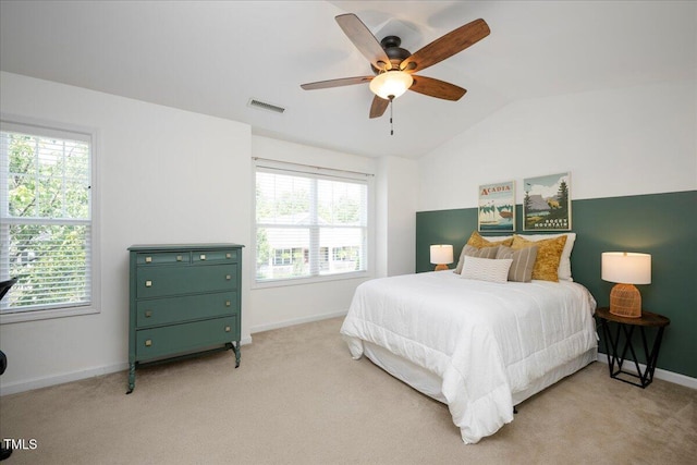 979 Branch Line Ln, Apex, NC 27502 - bedroom with multiple windows, vaulted ceiling, light carpet, and a ceiling fan