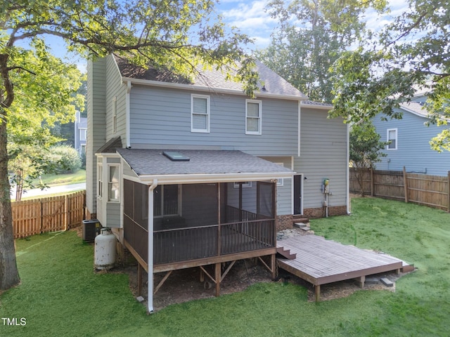 2205 Bufflehead Rd, Raleigh, NC 27616 - rear view of property featuring roof with shingles, a sunroom, a fenced backyard, and a deck