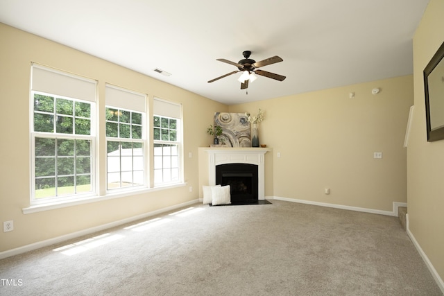617 Woodson Dr, Clayton, NC 27527 - unfurnished living room with a ceiling fan, carpet floors, and a fireplace with flush hearth