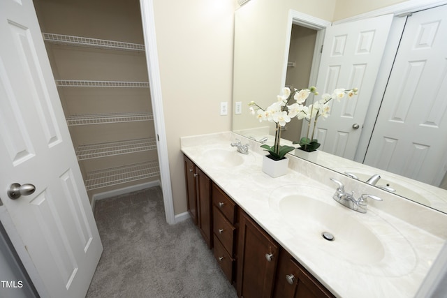 617 Woodson Dr, Clayton, NC 27527 - bathroom featuring double vanity and baseboards