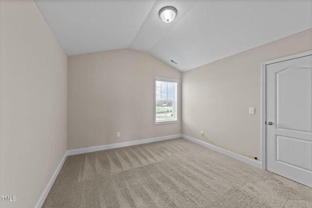 85 Twelve Oaks Dr, Willow Springs, NC 27592 - additional living space with vaulted ceiling and carpet