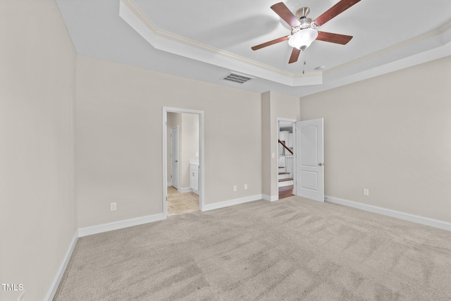 85 Twelve Oaks Dr, Willow Springs, NC 27592 - unfurnished bedroom with a raised ceiling, carpet floors, ensuite bathroom, crown molding, and a ceiling fan