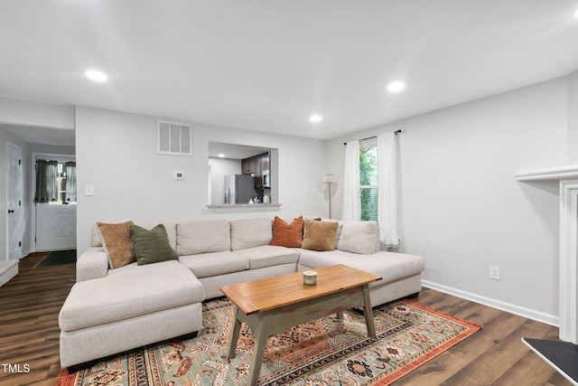 7286 Shellburne Dr, Raleigh, NC 27612 - living room featuring recessed lighting and dark wood-style floors
