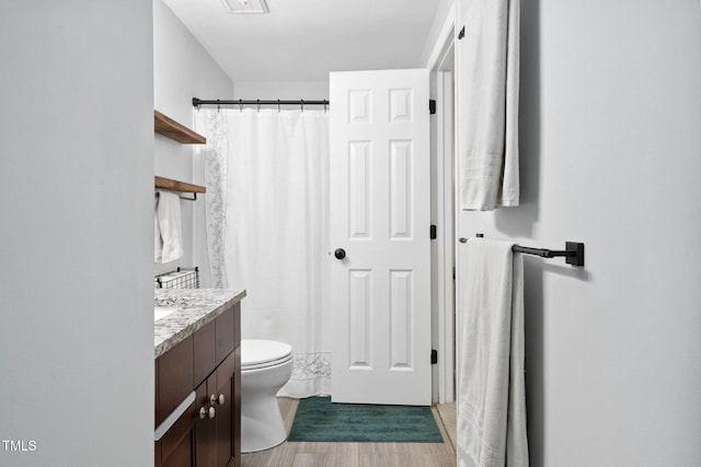 7286 Shellburne Dr, Raleigh, NC 27612 - full bath with vanity, wood finished floors, and a shower with shower curtain