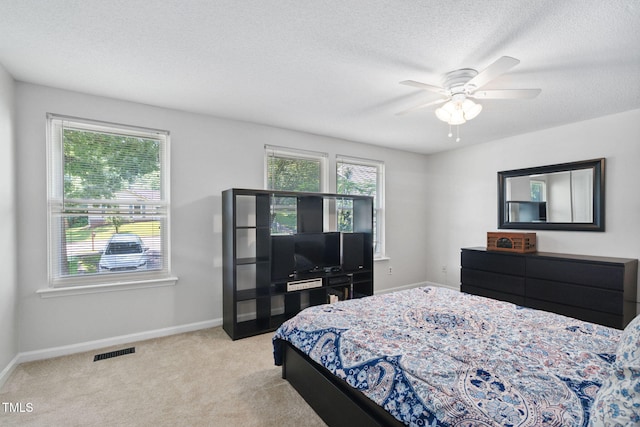 7286 Shellburne Dr, Raleigh, NC 27612 - bedroom with carpet, a textured ceiling, and a ceiling fan