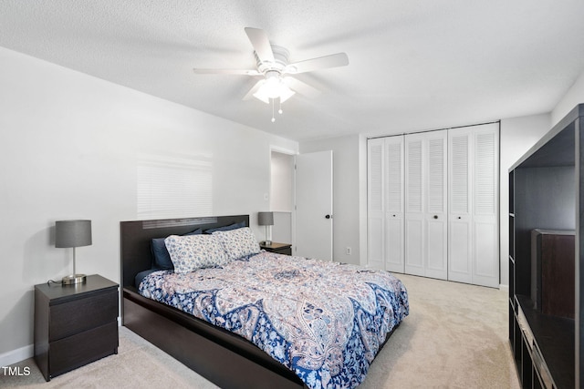 7286 Shellburne Dr, Raleigh, NC 27612 - bedroom with light colored carpet, a closet, and a ceiling fan
