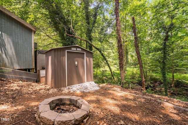 7286 Shellburne Dr, Raleigh, NC 27612 - view of shed featuring a fire pit