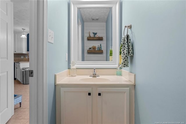 195 Hogart St, Raeford, NC 28376 - bathroom featuring tile patterned floors, vanity, and a textured ceiling