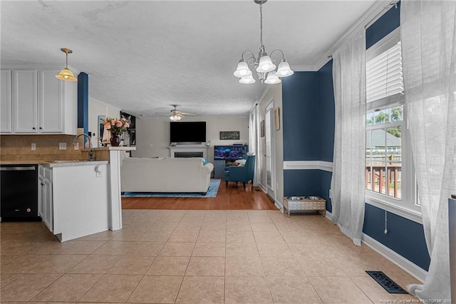 195 Hogart St, Raeford, NC 28376 - kitchen featuring dishwasher, a ceiling fan, white cabinetry, hanging light fixtures, and light countertops