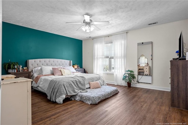 195 Hogart St, Raeford, NC 28376 - bedroom with wood finished floors, a textured ceiling, and a ceiling fan