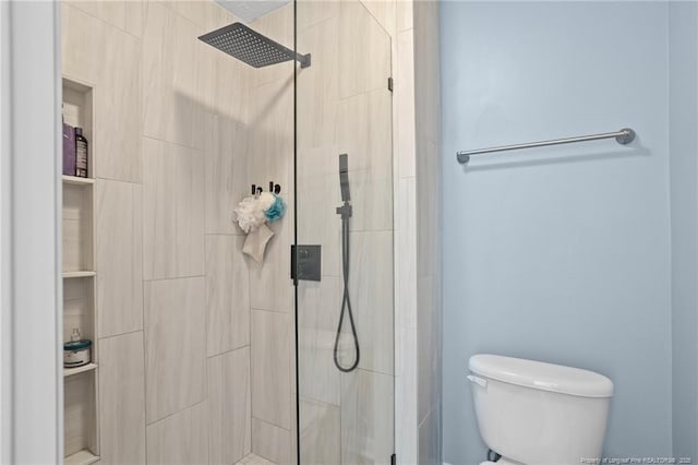195 Hogart St, Raeford, NC 28376 - bathroom with a tile shower and toilet