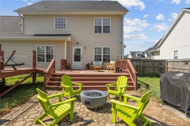 195 Hogart St, Raeford, NC 28376 - rear view of house featuring an outdoor fire pit, a deck, and roof with shingles