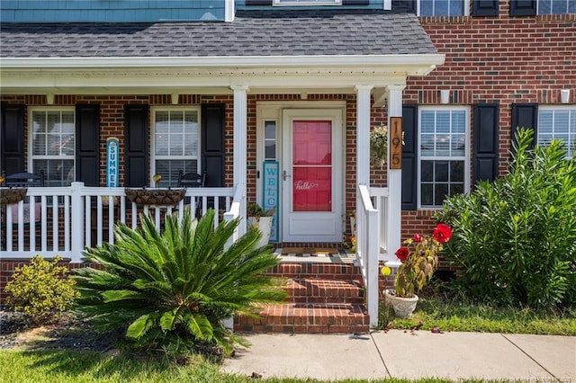 195 Hogart St, Raeford, NC 28376 - property entrance with roof with shingles and a porch