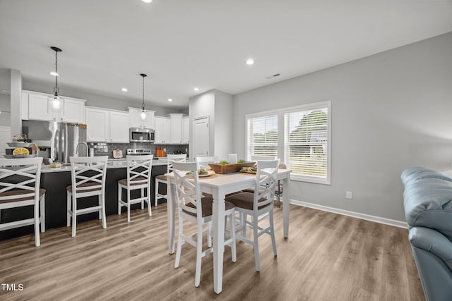 19 Linda Lou Ln Unit 19, Angier, NC 27501 - dining space with light wood finished floors and recessed lighting