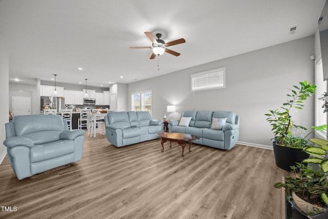 19 Linda Lou Ln Unit 19, Angier, NC 27501 - living room with a ceiling fan, light wood finished floors, and recessed lighting