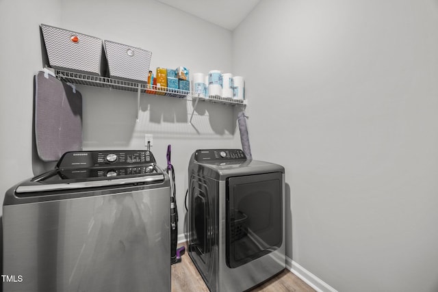 19 Linda Lou Ln Unit 19, Angier, NC 27501 - washroom with washing machine and clothes dryer and light wood-style floors
