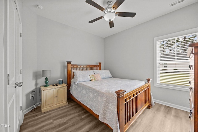 19 Linda Lou Ln Unit 19, Angier, NC 27501 - bedroom with light wood-type flooring and ceiling fan