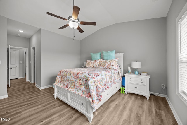 19 Linda Lou Ln Unit 19, Angier, NC 27501 - bedroom with light wood-style flooring, vaulted ceiling, and a ceiling fan