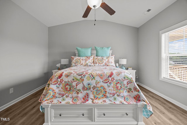 19 Linda Lou Ln Unit 19, Angier, NC 27501 - bedroom featuring wood finished floors, vaulted ceiling, and a ceiling fan