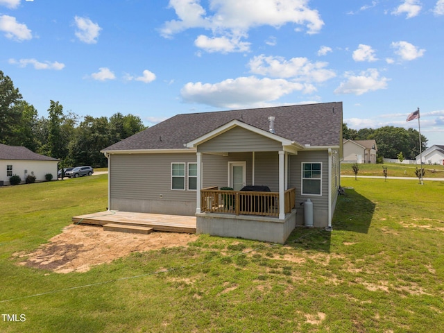 19 Linda Lou Ln Unit 19, Angier, NC 27501 - rear view of property featuring a lawn, a wooden deck, and a shingled roof