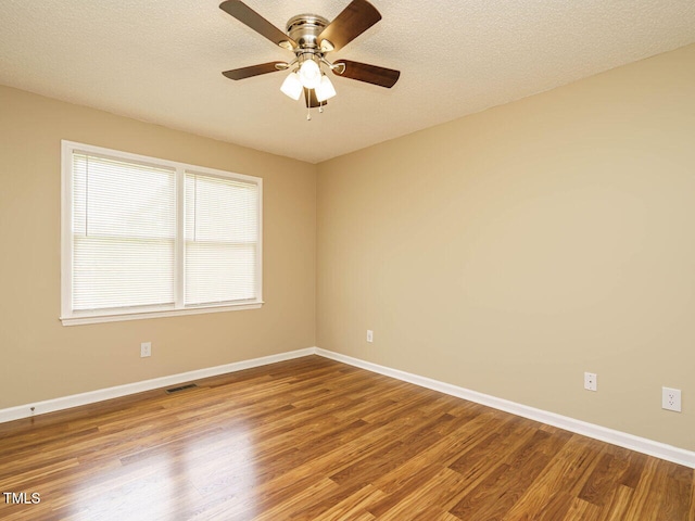 635 Raymond Dr, Wendell, NC 27591 - empty room with wood finished floors and a ceiling fan
