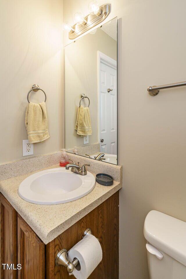 635 Raymond Dr, Wendell, NC 27591 - bathroom with vanity and toilet