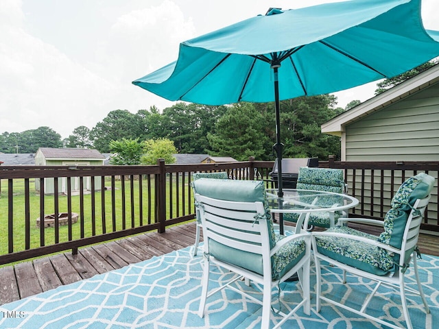 635 Raymond Dr, Wendell, NC 27591 - deck featuring outdoor dining area and a yard