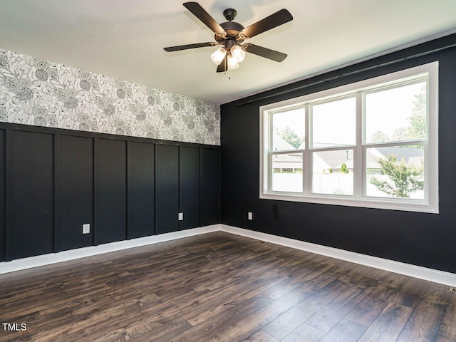 2013 Woodbluff Dr, Wendell, NC 27591 - unfurnished room featuring wainscoting, dark wood-type flooring, ceiling fan, and wallpapered walls