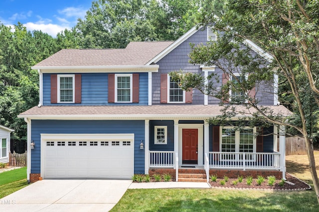 605 Catlin Rd, Cary, NC 27519 - view of front facade with concrete driveway, a shingled roof, covered porch, and an attached garage