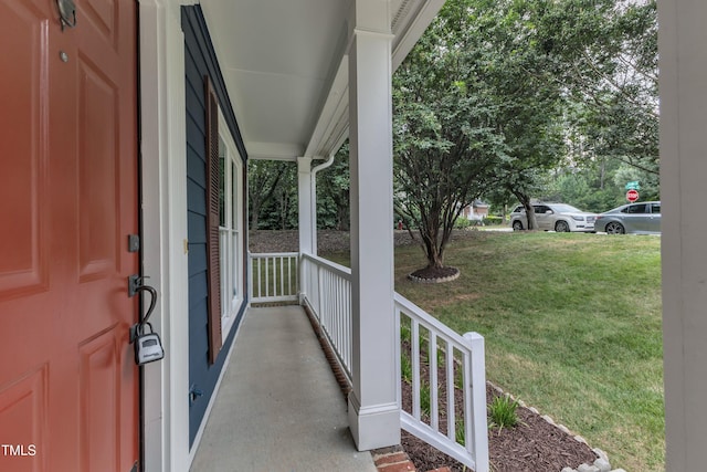 605 Catlin Rd, Cary, NC 27519 - view of exterior entry with covered porch and a lawn