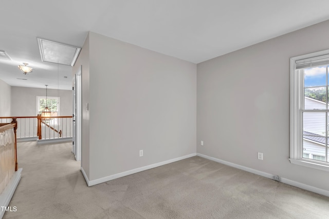 605 Catlin Rd, Cary, NC 27519 - spare room featuring attic access, light carpet, and healthy amount of natural light