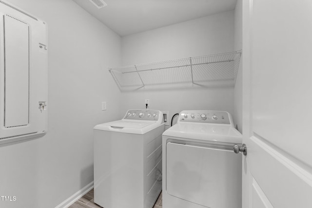 156 Velvet Ridge Way, Garner, NC 27529 - laundry room with washing machine and dryer and light wood-style flooring