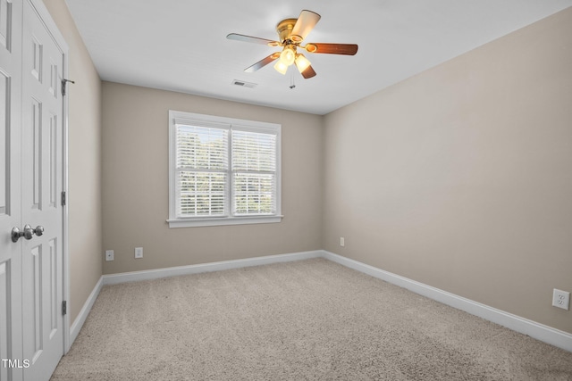 6965 Ogburn Farms Dr, Willow Springs, NC 27592 - unfurnished bedroom with a closet, carpet floors, and a ceiling fan