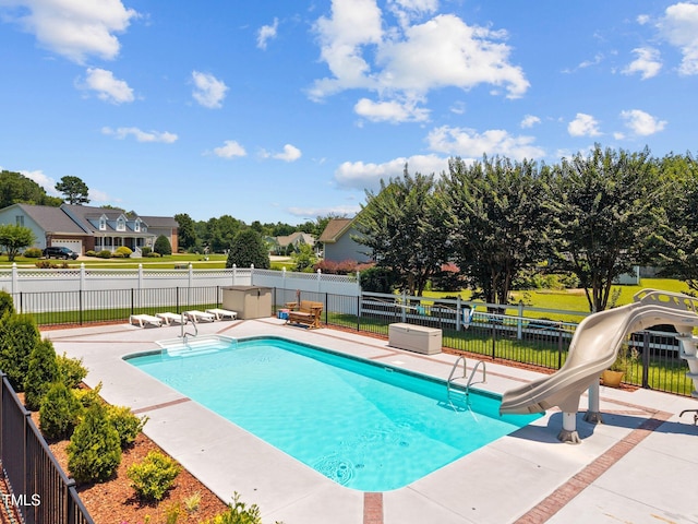 6965 Ogburn Farms Dr, Willow Springs, NC 27592 - view of pool with a water slide and a patio area