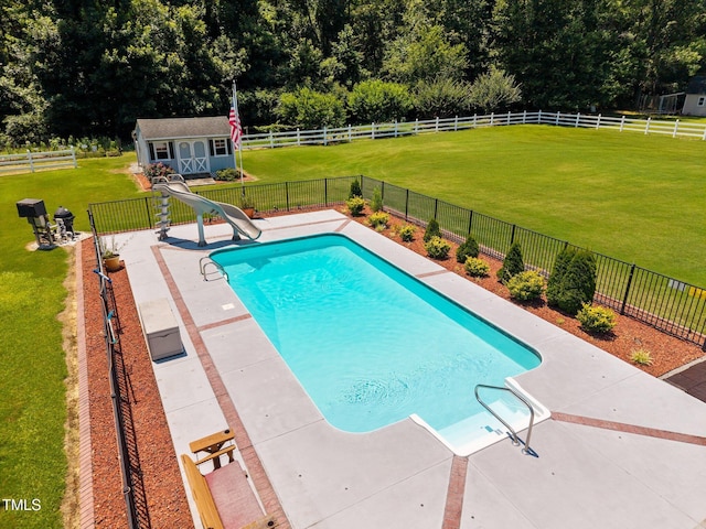 6965 Ogburn Farms Dr, Willow Springs, NC 27592 - view of pool with a water slide, an outdoor structure, a patio, and a fenced backyard