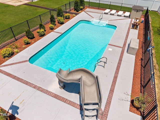 6965 Ogburn Farms Dr, Willow Springs, NC 27592 - view of swimming pool with a water slide, a fenced backyard, and a patio area