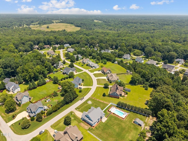 6965 Ogburn Farms Dr, Willow Springs, NC 27592 - aerial view of residential area with a heavily wooded area