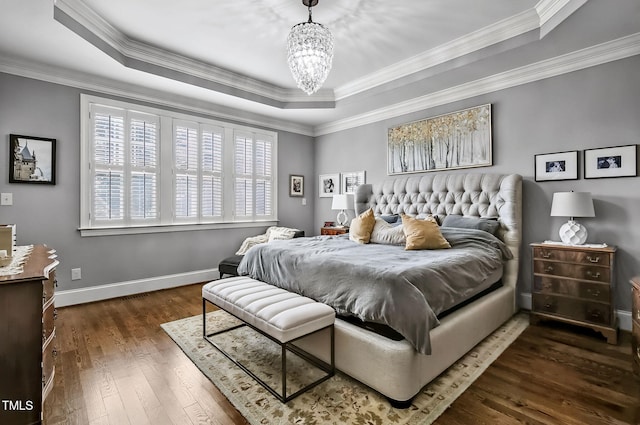 39 Wood Stork Ct, Clayton, NC 27520 - bedroom featuring a raised ceiling, a chandelier, dark wood finished floors, and ornamental molding