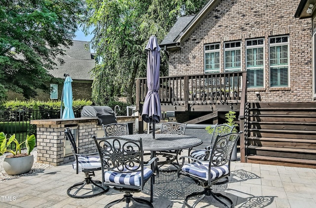 39 Wood Stork Ct, Clayton, NC 27520 - view of patio with area for grilling, outdoor dining area, a deck, and a bar