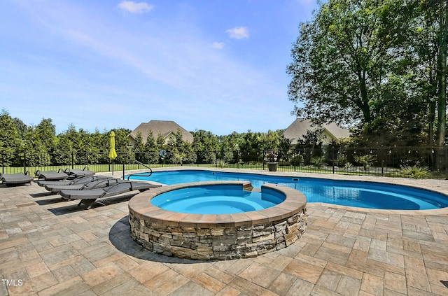 39 Wood Stork Ct, Clayton, NC 27520 - view of swimming pool with a patio area and a pool with connected hot tub
