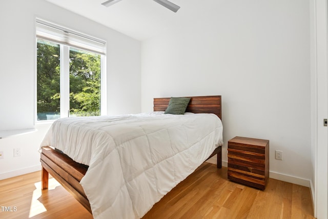 402 Chavis Way, Raleigh, NC 27601 - bedroom featuring light wood-style floors and a ceiling fan
