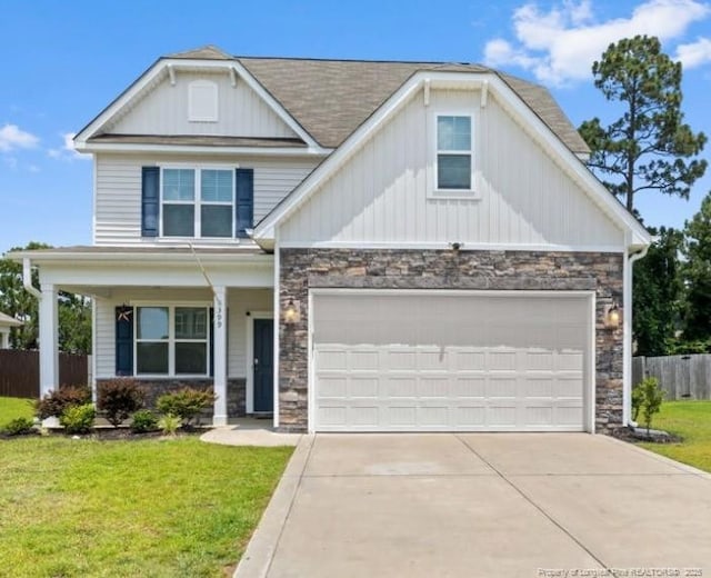 399 Springhaven Dr, Raeford, NC 28376 - craftsman-style home featuring stone siding, driveway, and covered porch